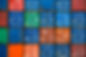 Four vertical rows of shipping containers