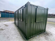Exterior view of green cabin 