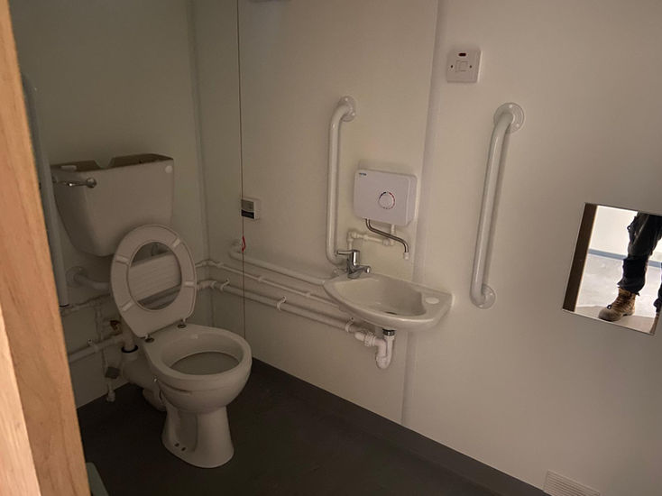 Internal view of cabin with disability toilet 